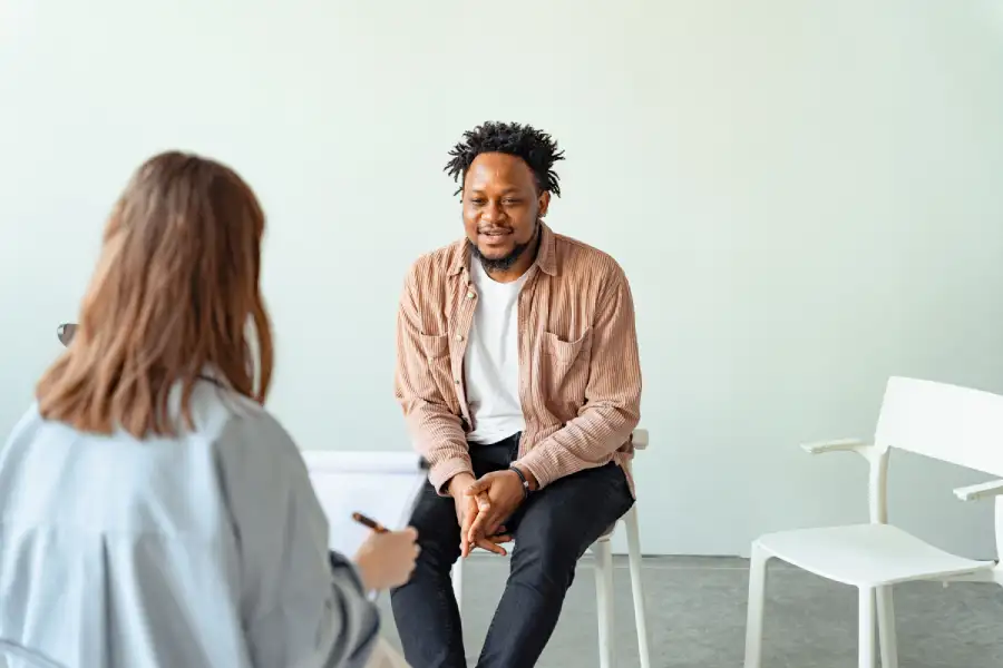 Therapist conducting a comprehensive mental health assessment.