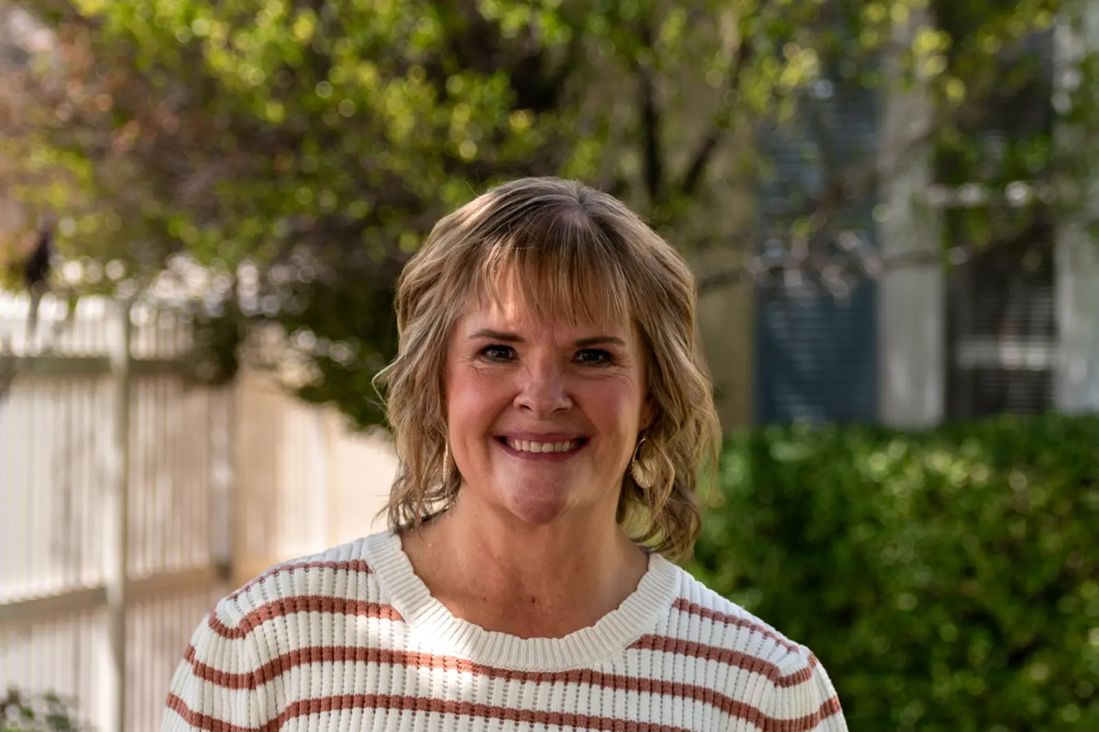 1.tina-smith-atc-team. Tina Smith, Office Manager at At The Crossroads (ATC), professional headshot